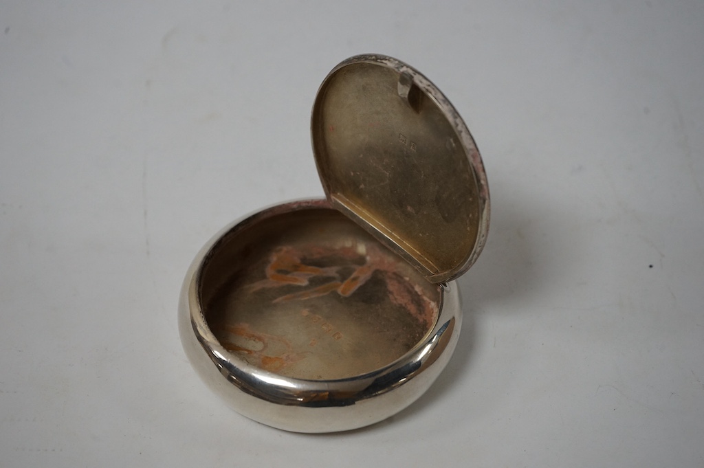 An Edwardian silver circular tobacco box, by A & J Zimmerman, Birmingham, 1905, 79mm, with engraved monogram. Condition - fair to good